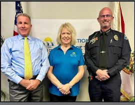  Superintendent Axford, Sheriff Ramsey and Chief Brandenburg standing advising parents of safety.